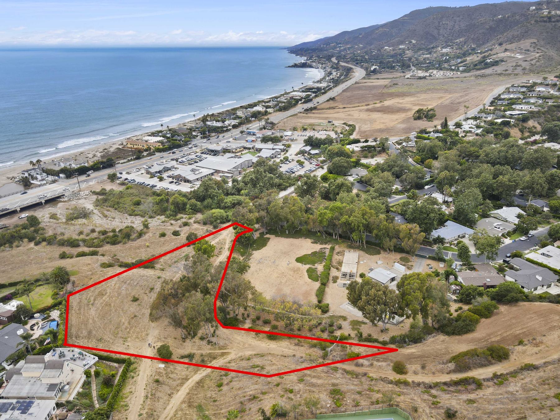 Looking up the coast, the parcel outlined above Zuma